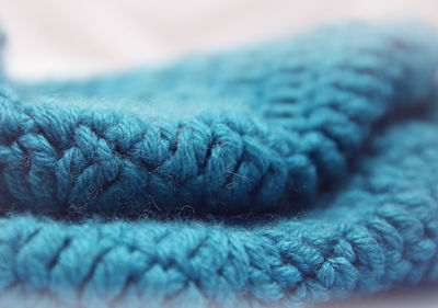 Close-up of blue fabric against white background