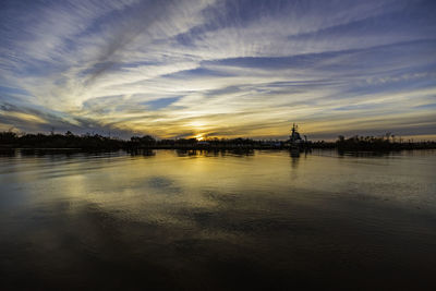 Scenic view of lake against sky during sunset