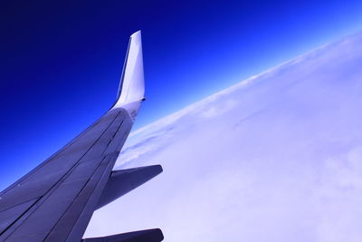 Low angle view of airplane flying in sky