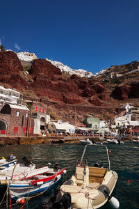 Boats moored at harbor
