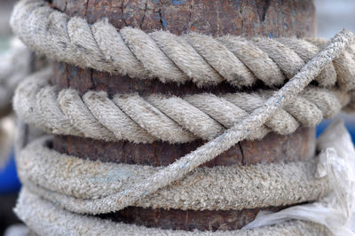 Close-up of rope tied on wood