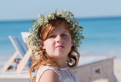 Close-up of girl against sea