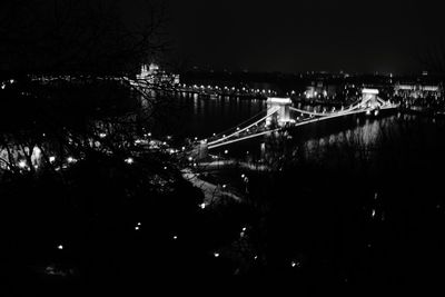 High angle view of illuminated bridge over river at night