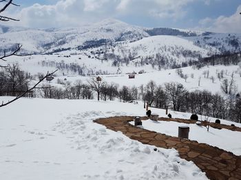 Scenic view of snowcapped mountains against sky