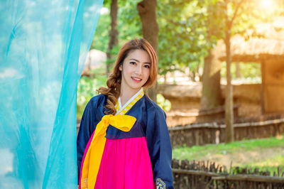 Portrait of smiling beautiful woman wearing hanbok