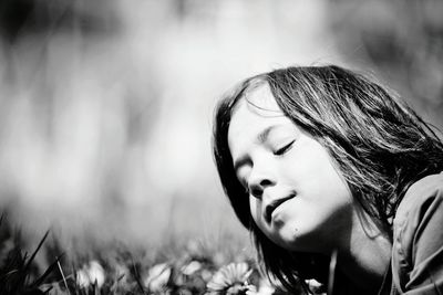 Close-up portrait of boy on grass