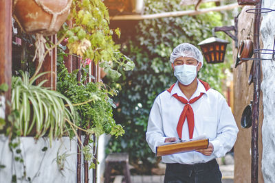 Waiter with traditional uniform of peruvian restaurant, a traditonal picanteria restaurant 