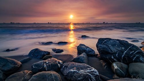 Scenic view of sea against sky during sunset