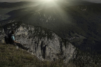 Man looking at view of mountain