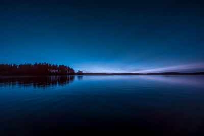 Scenic view of lake against blue sky during blue hour