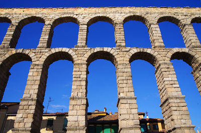 Low angle view of historical building against blue sky