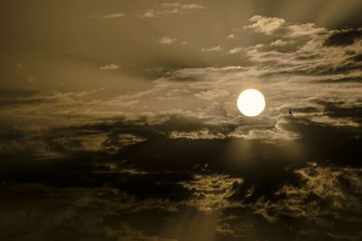 Low angle view of moon against sky during sunset