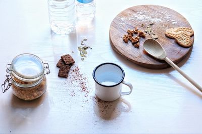 High angle view of wine and coffee on table