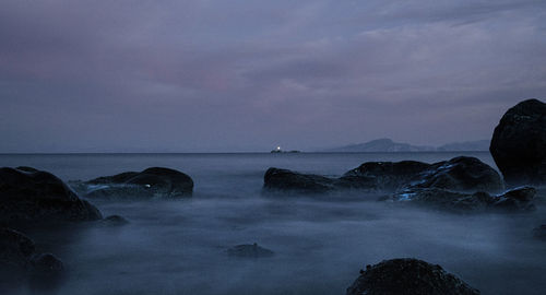 Scenic view of sea against sky at dusk