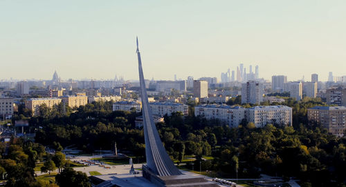 High angle view of city buildings against clear sky