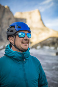 Portrait of mountain climber wearing all blue.