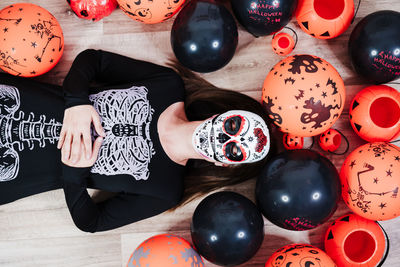 High angle view of woman with balloons