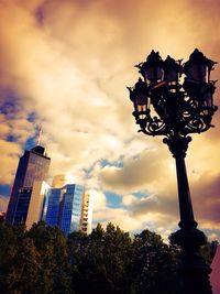 Low angle view of tower against cloudy sky