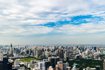 High angle view of city buildings against sky