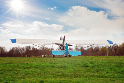 Built structure on field against sky