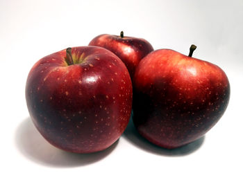 Close-up of apple against white background