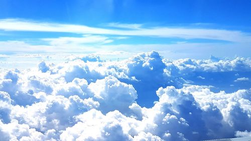 Aerial view of clouds over mountains