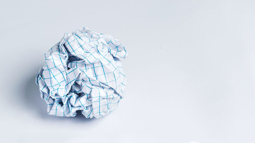 Close-up of paper decoration against white background