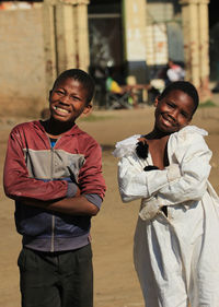 Portrait of a smiling young man standing outdoors