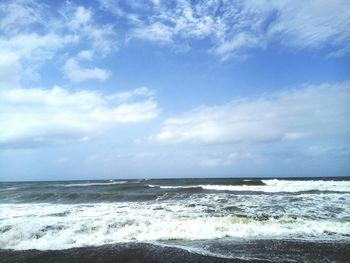 Scenic view of sea and cloudy sky