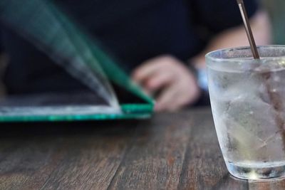 Glass of drink on table