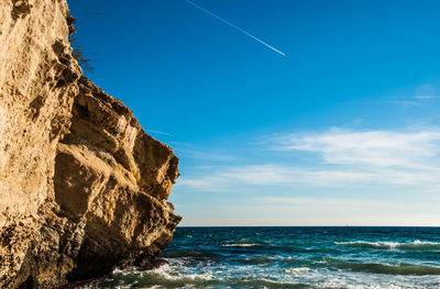 Scenic view of sea against clear blue sky