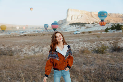 Young woman standing on field