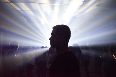 Silhouette people at music concert