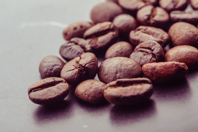 Close-up of coffee beans on table