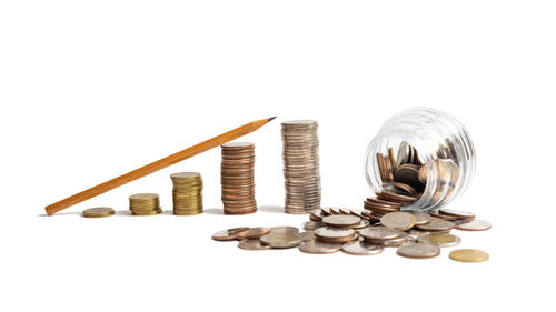 High angle view of coins on white background