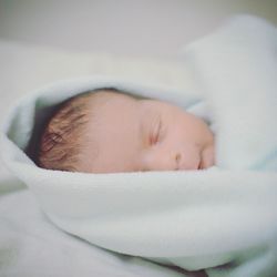 Close-up of cute baby sleeping