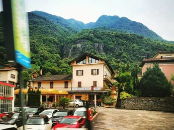 Houses against mountains in city