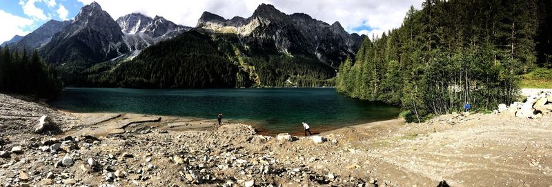 Panoramic view of trees and mountains against sky