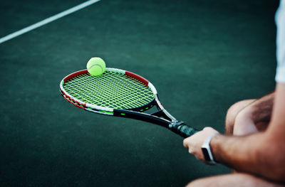 Cropped image of man playing tennis