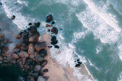 High angle view of rocks in sea