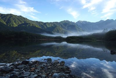 Scenic view of lake with mountains in background