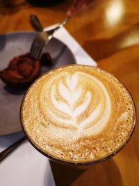 Close-up of cappuccino on table