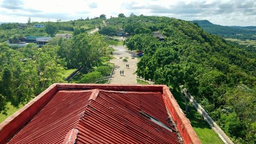 High angle view of trees and buildings against sky