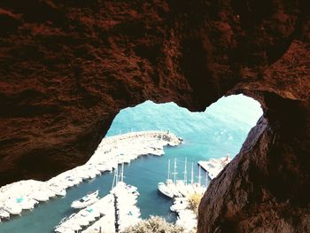 Scenic view of sea seen through cave