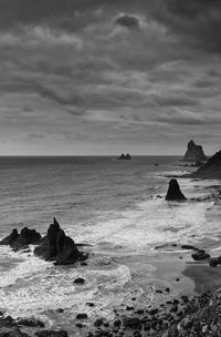 Scenic view of sea against cloudy sky