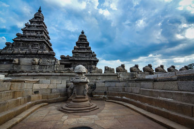 Statue of historic temple against sky