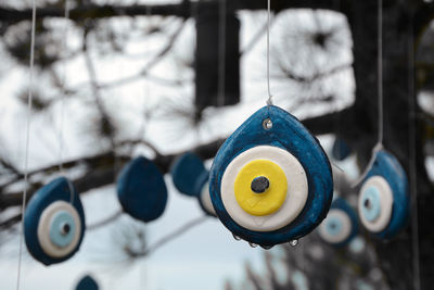 Close-up of stuffed toy hanging on metal