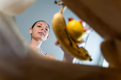 Low angle view of woman smiling