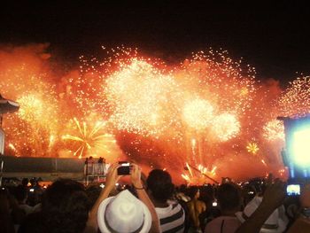 People enjoying music concert at night