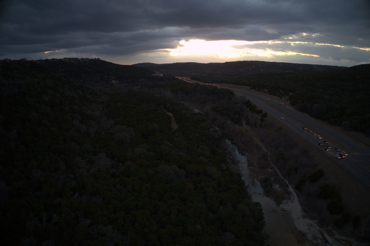 SCENIC VIEW OF ROAD AGAINST SKY DURING SUNSET